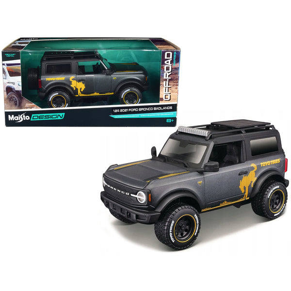 2021 Ford Bronco Badlands Dark Gray Metallic with Gold Graphics and Roof Rack "Off-Road" "Maisto Design" Series 1/24 Diecast Model Car by Maisto