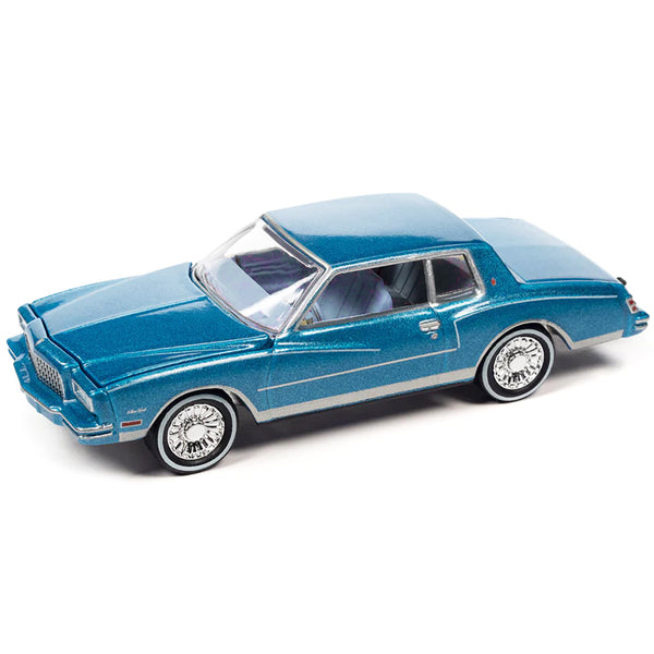 1980 Chevrolet Monte Carlo Bright Blue Metallic with Blue Interior with Bass Boat and Trailer Limited Edition to 7264 pieces Worldwide "Tow & Go" Series 1/64 Diecast Model Car by Johnny Lightning