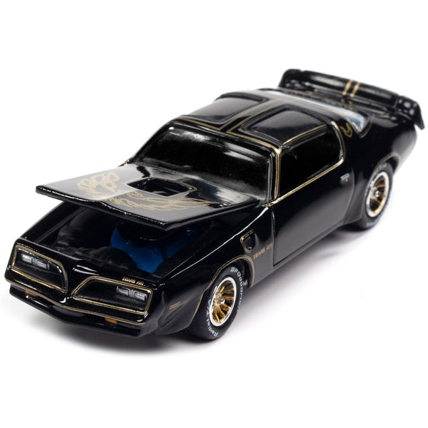 1977 Pontiac Trans Am Black with Gold Eagle Graphic with Poker Chip Collector's Token and Game Card "Trivial Pursuit" "Pop Culture" 2022 Release 4 1/64 Diecast Model Car by Johnny Lightning