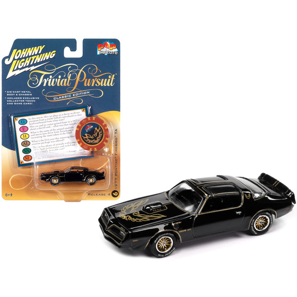 1977 Pontiac Trans Am Black with Gold Eagle Graphic with Poker Chip Collector's Token and Game Card "Trivial Pursuit" "Pop Culture" 2022 Release 4 1/64 Diecast Model Car by Johnny Lightning